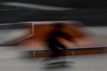 Boy practices skateboarding in Jakarta, Indonesia